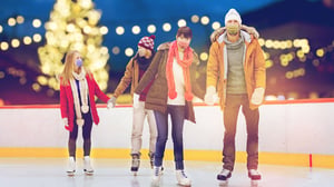 Couples-with-masks-ice-skating-with-holiday-lights_16to9