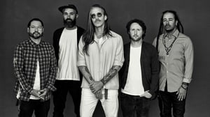 Incubus Posing In A Gray Image