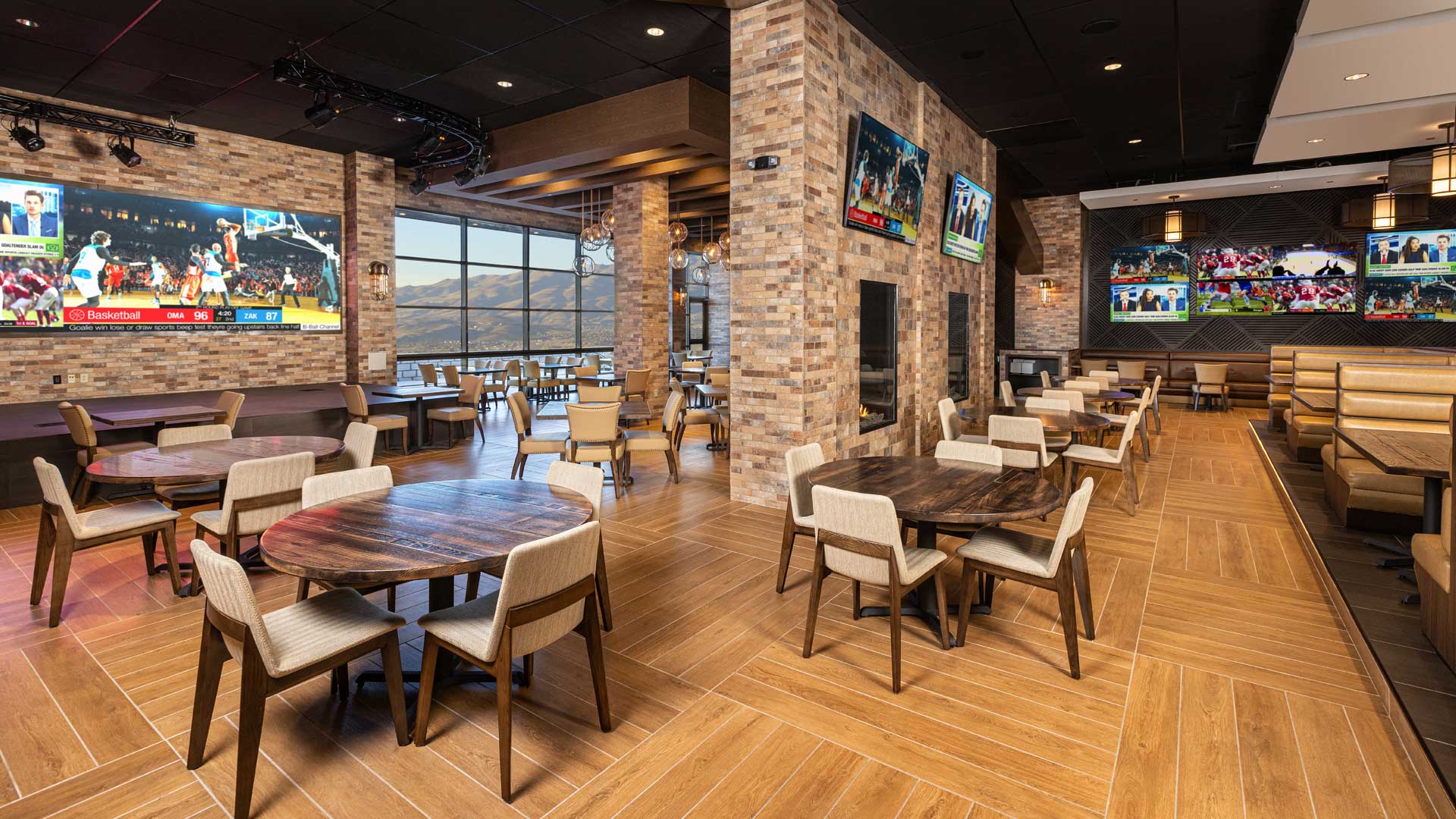 Chickies-and-Petes-dining-room-with-stage-fire-places-and-view-outside-hero-image_v01_1920x1080
