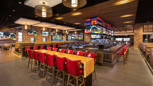 Photo of Chickie' & Pete's bar entrance with large table.