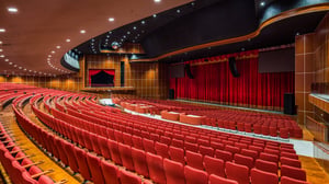 Grand Theatre auditorium view of curtained stage.