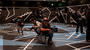Photo of people playing virtual reality game in Max Action Arena at GSR.